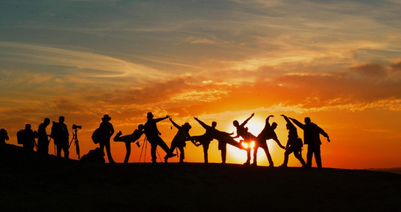 Group silhouetted by the Sunset Credit Pixabay Pexels